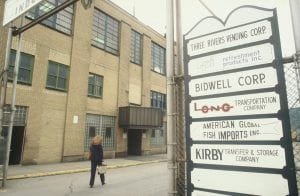 A sign in 1980 that displays the name 'Bidwell Corp.'
